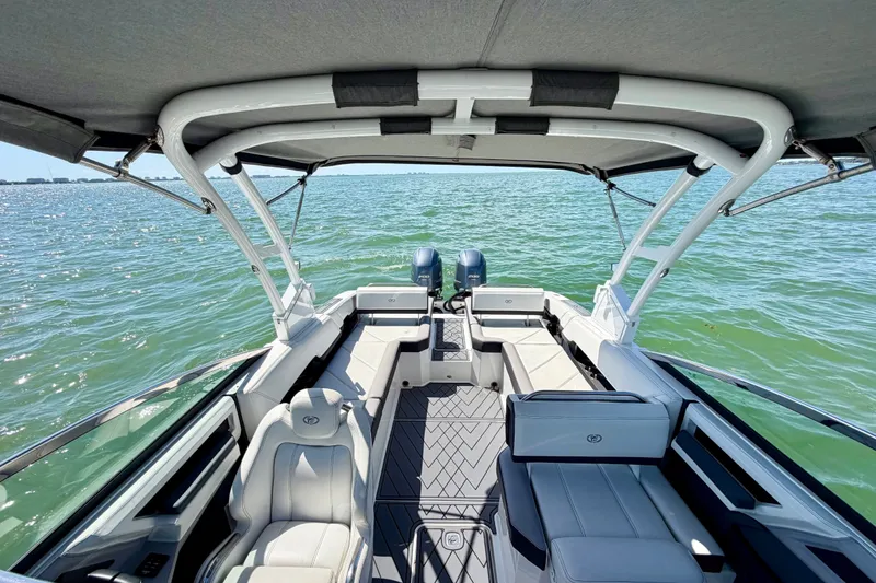 Slide: The Image of 2022 Cobalt R8 Outboard boat interior with seating, on a sunny day at sea. - 13