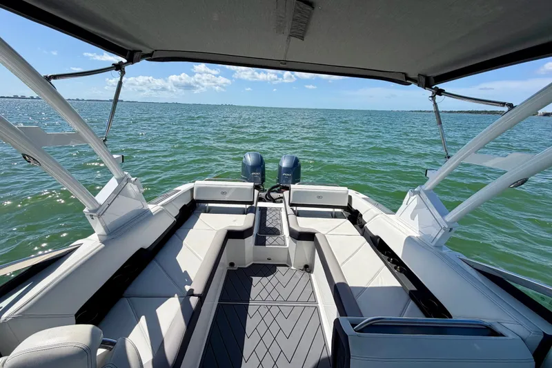 Slide: The Image of 2022 Cobalt R8 Outboard boat interior with seating, on a sunny day at sea. - 14