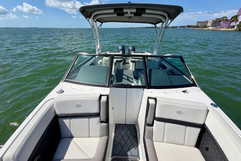 Slide: The Image of 2022 Cobalt R8 Outboard boat on open water, featuring sleek design and comfortable seating. - 25