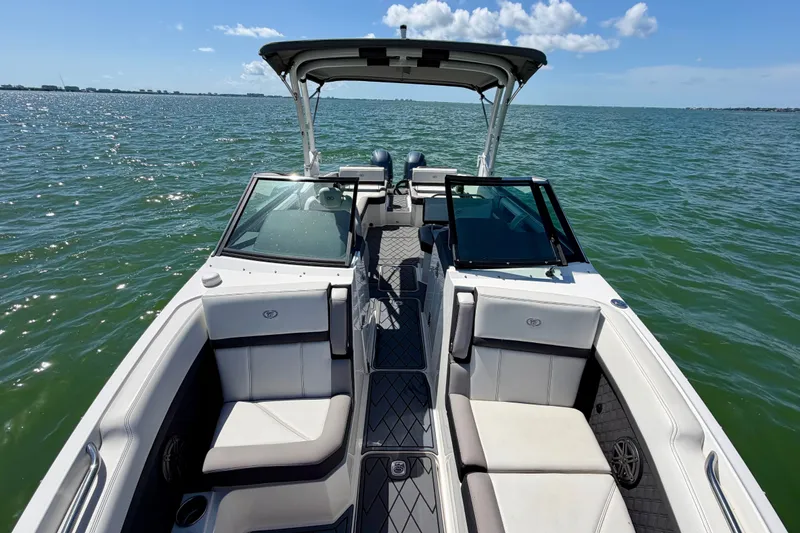 Slide: The Image of 2022 Cobalt R8 Outboard boat on open water, featuring spacious seating and sleek design. - 24