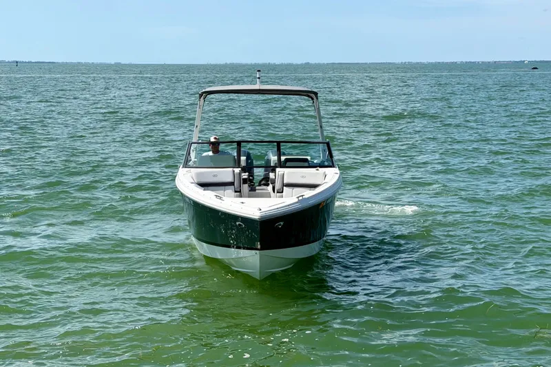 Slide: The Image of 2022 Cobalt R8 Outboard boat cruising on open water. - 7