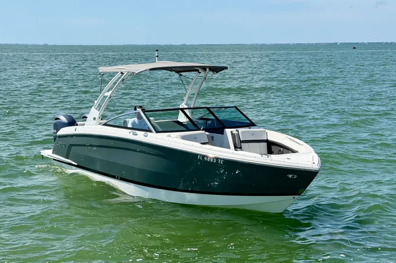 Slide: The Image of 2022 Cobalt R8 Outboard boat cruising on open water under clear skies. - 3