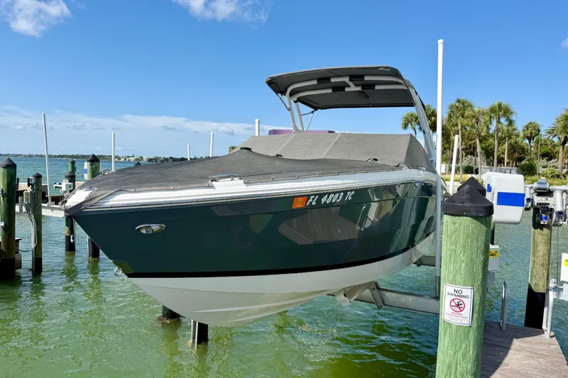 Slide: The Image of 2022 Cobalt R8 Outboard boat docked on a sunny day with clear blue skies. - 37