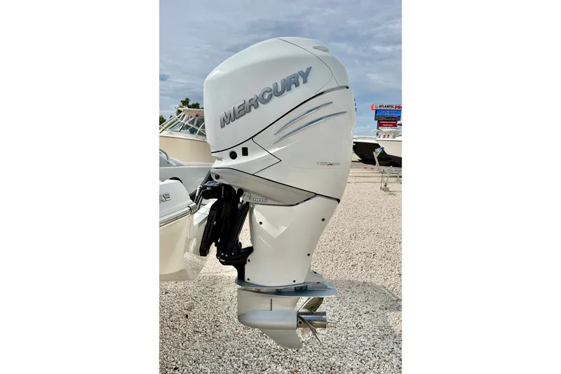 Slide: The Image of 2024 Crownline Eclipse E285 XS with Mercury outboard engine on display. - 26