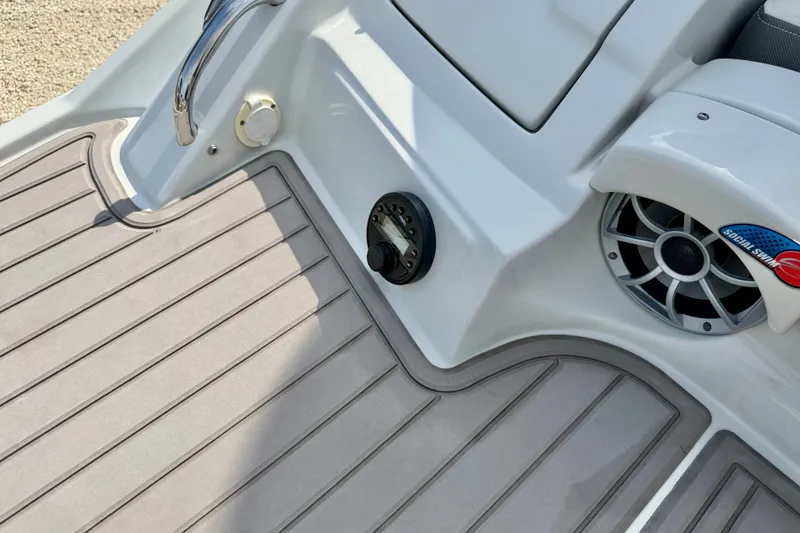 Slide: The Image of 2024 Crownline Eclipse E285 XS boat deck with speaker and control panel. - 33