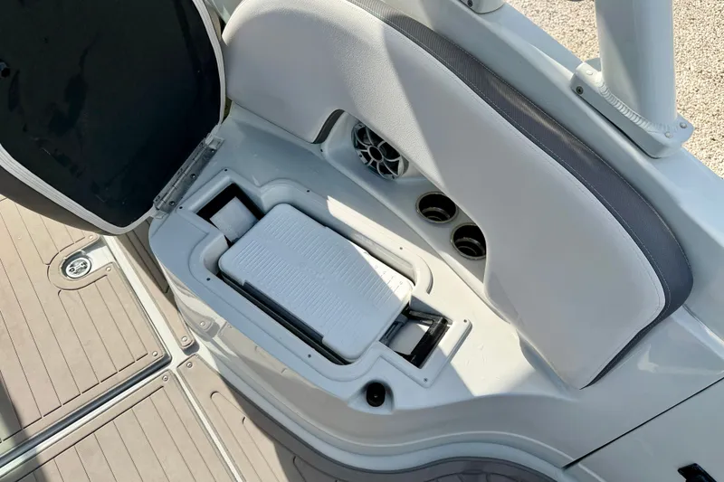 Slide: The Image of 2024 Crownline Eclipse E285 XS boat interior with storage compartment and seating. - 20