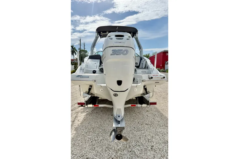 Slide: The Image of 2024 Crownline Eclipse E285 XS boat with powerful 350 engine, rear view. - 25