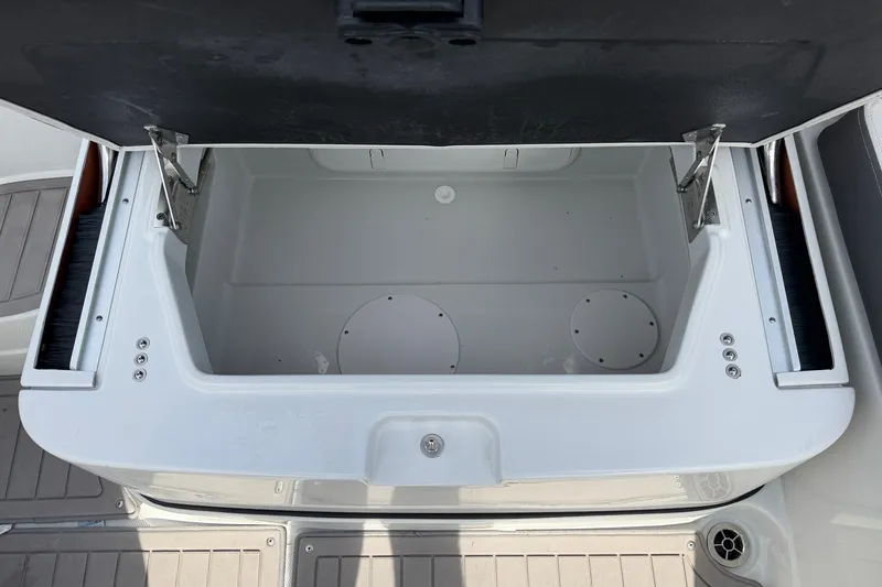 Slide: The Image of Open storage compartment on 2024 Crownline Eclipse E285 XS boat. - 30