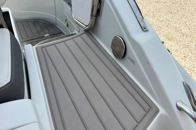 Slide: The Image of 2024 Crownline Eclipse E285 XS boat deck with sleek, modern design and durable flooring. - 32