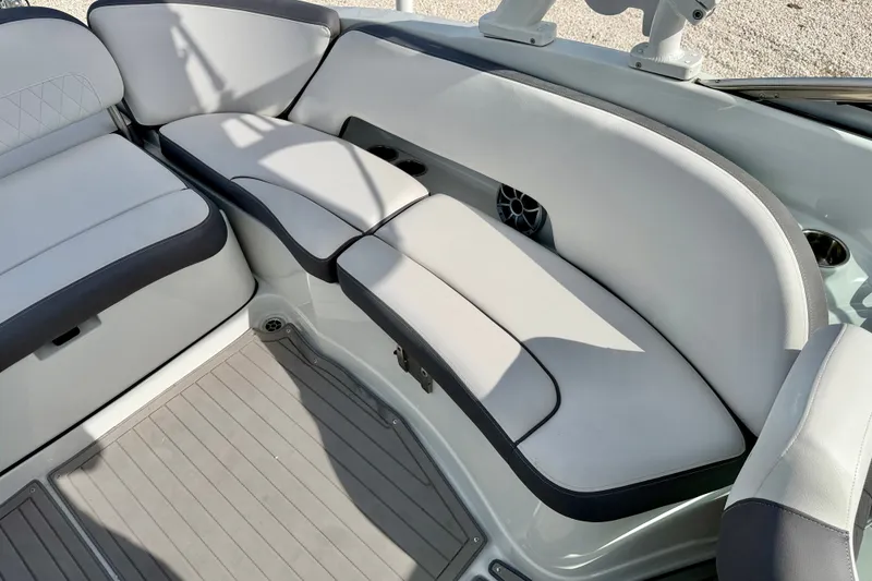Slide: The Image of 2024 Crownline Eclipse E285 XS boat interior with sleek, cushioned seating and modern design. - 17