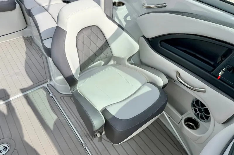 Slide: The Image of 2024 Crownline Eclipse E285 XS boat interior with luxurious seating and modern design. - 14