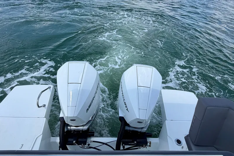 Slide: The Image of 2023 Beneteau Antares 11 OB with twin Mercury outboard engines on water. - 15