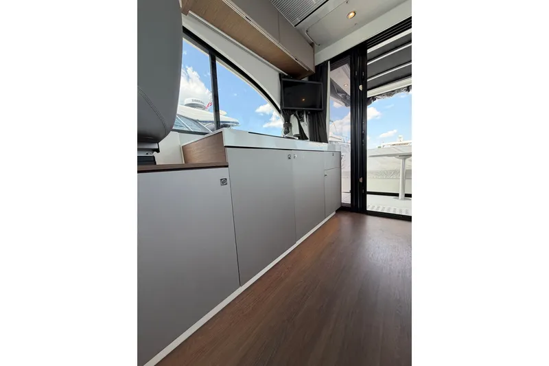 Slide: The Image of Interior view of 2023 Beneteau Antares 11 OB yacht, featuring sleek cabinetry and modern design. - 79