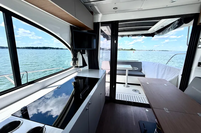 Slide: The Image of Interior view of 2023 Beneteau Antares 11 OB yacht with scenic ocean backdrop. - 36