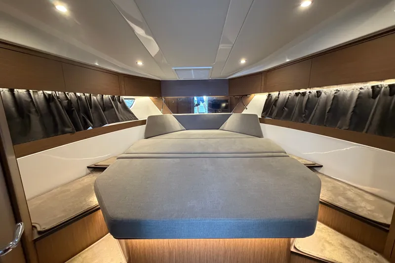 Slide: The Image of Luxurious interior cabin of 2023 Beneteau Antares 11 OB with elegant wood finishes. - 56
