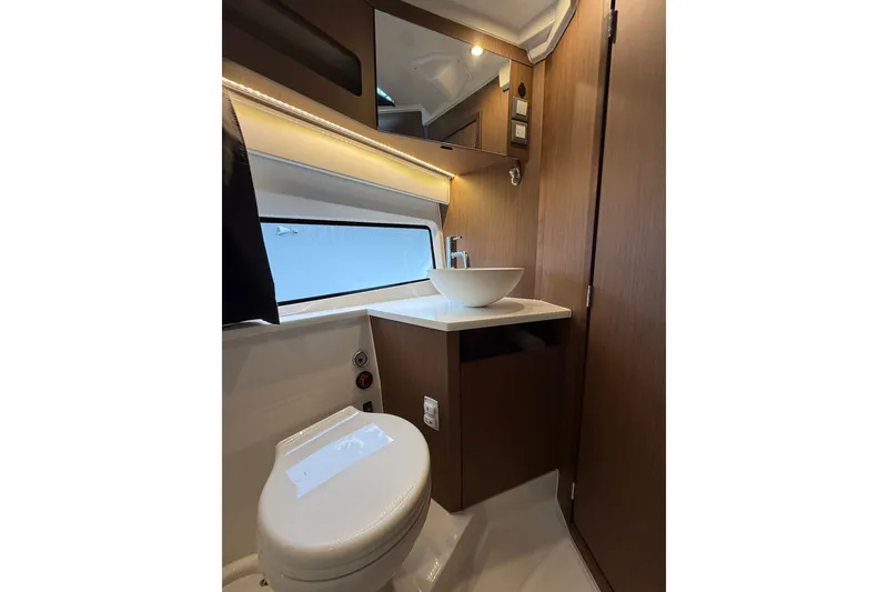 Slide: The Image of Modern bathroom interior of 2023 Beneteau Antares 11 OB boat, featuring sleek design elements. - 52