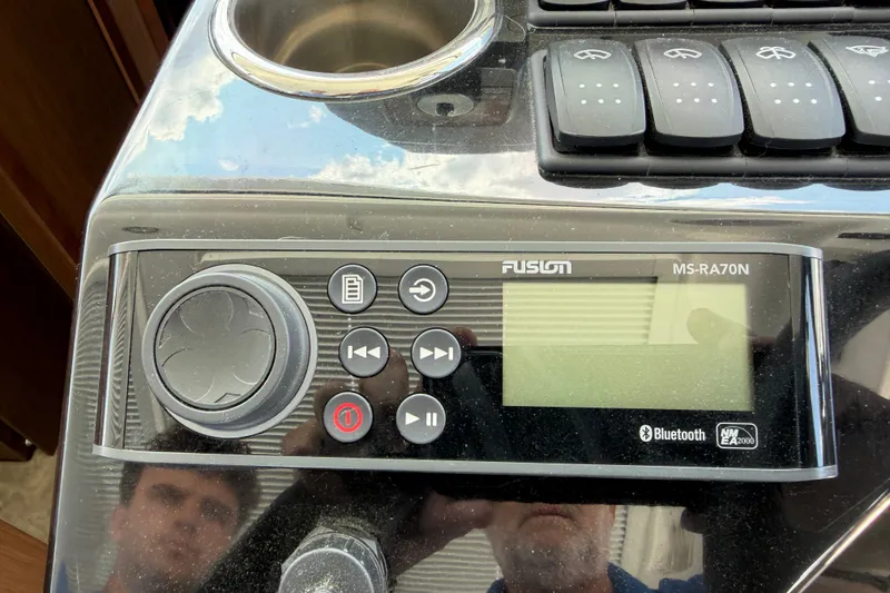 Slide: The Image of Fusion MS-RA70N audio system on 2023 Beneteau Antares 11 OB boat dashboard. - 42