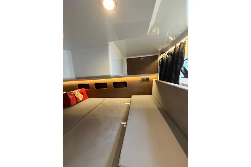 Slide: The Image of Interior cabin of 2023 Beneteau Antares 11 OB, featuring cozy seating and modern design. - 73