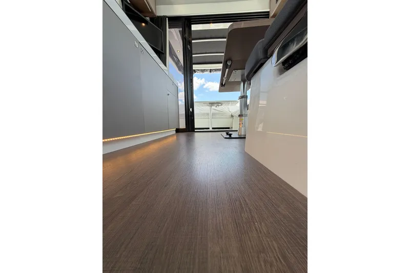 Slide: The Image of Interior view of 2023 Beneteau Antares 11 OB, showcasing sleek flooring and modern design. - 81
