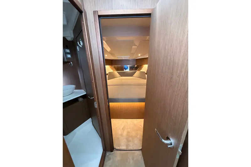Slide: The Image of 2023 Beneteau Antares 11 OB cabin interior with modern wood finish. - 61