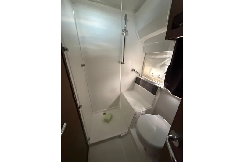 Slide: The Image of Bathroom interior of 2023 Beneteau Antares 11 OB boat, featuring shower and toilet. - 49