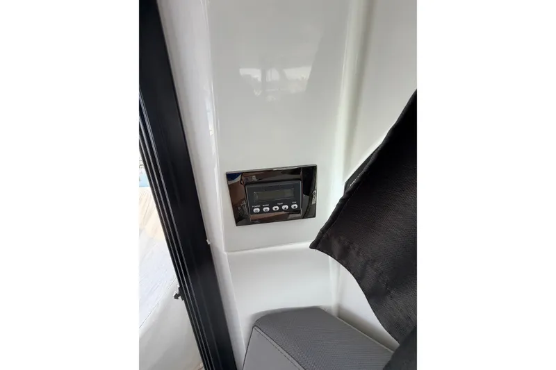 Slide: The Image of Control panel inside 2023 Beneteau Antares 11 OB boat, featuring sleek design and modern technology. - 101