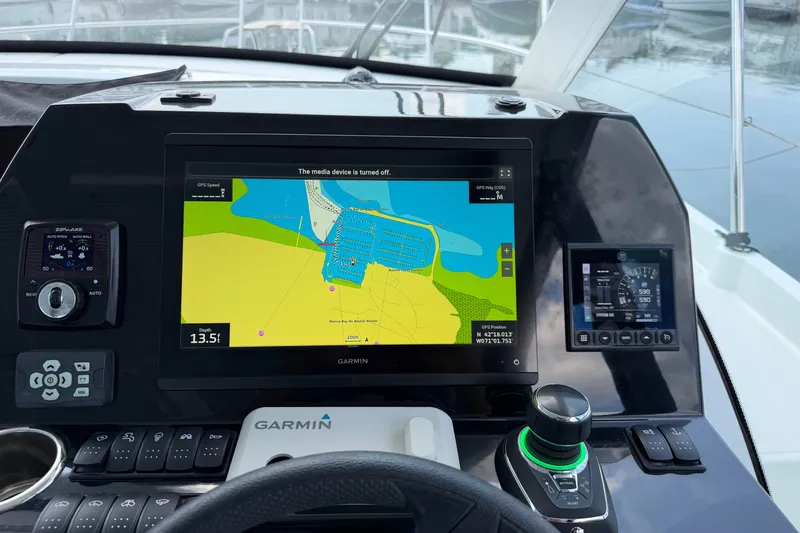Slide: The Image of Cockpit of 2023 Beneteau Antares 11 OB with Garmin navigation system and controls. - 44