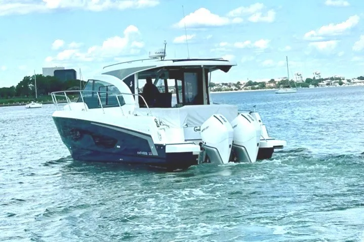 Slide: The Image of 2023 Beneteau Antares 11 OB cruising on a calm, scenic waterway. - 4