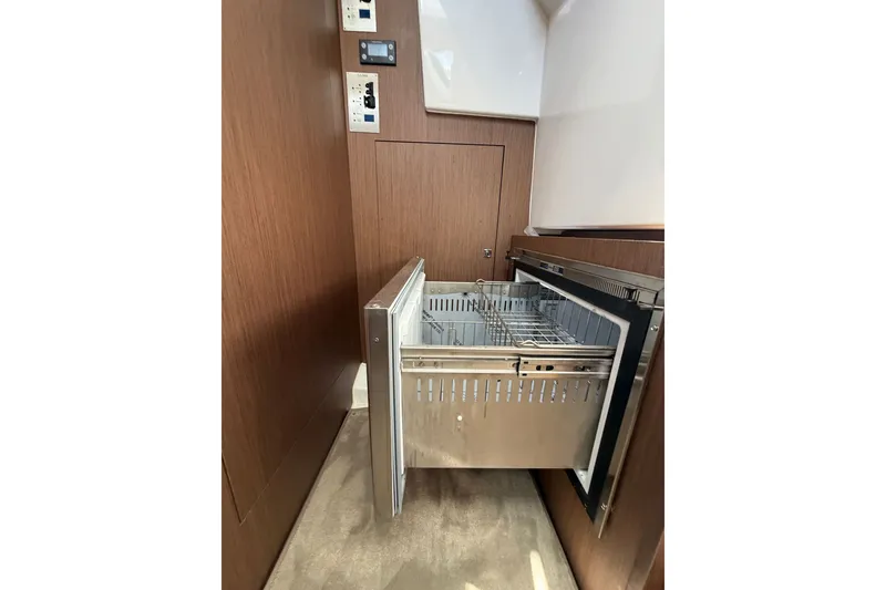 Slide: The Image of Open drawer in 2023 Beneteau Antares 11 OB yacht interior, showcasing modern design. - 66