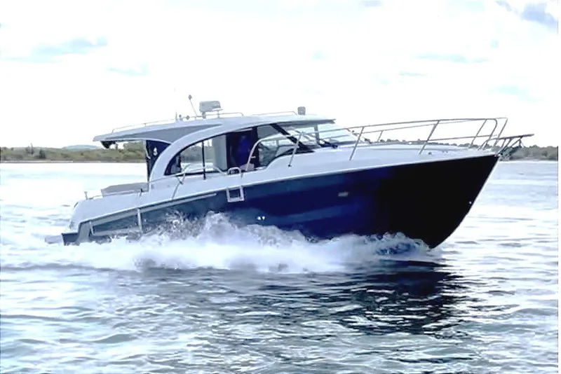 Slide: The Image of 2023 Beneteau Antares 11 OB cruising on a sunny day with blue skies. - 1