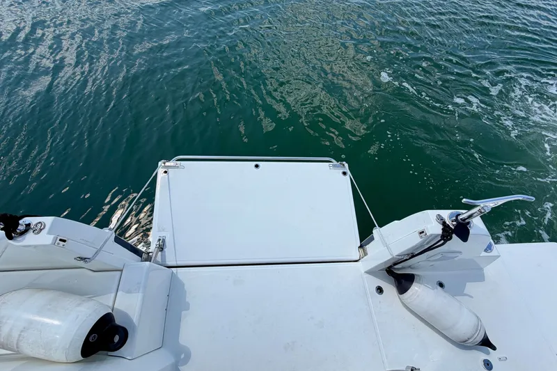 Slide: The Image of 2023 Beneteau Antares 11 OB swim platform with fenders on calm water. - 33