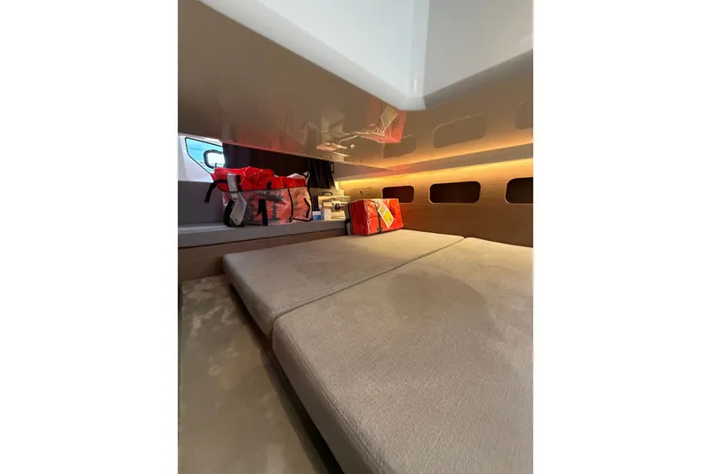 Slide: The Image of Interior cabin of 2023 Beneteau Antares 11 OB with cozy bedding and storage. - 77