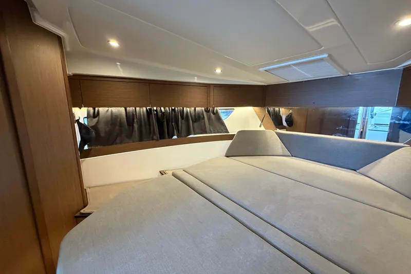 Slide: The Image of Interior cabin of 2023 Beneteau Antares 11 OB, featuring modern design and comfortable seating. - 59