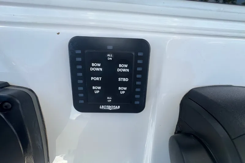 Slide: The Image of Control panel on a 2022 Tidewater 2410 Bay Max boat dashboard. - 26