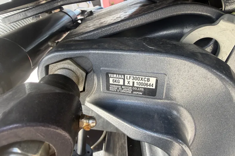 Slide: The Image of Close-up of Yamaha LF300XCB engine part on 2022 Tidewater 2410 Bay Max boat. - 51