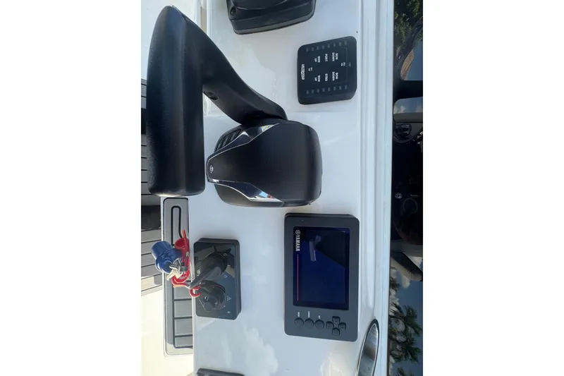 Slide: The Image of Control panel of 2022 Tidewater 2410 Bay Max boat with Yamaha display and throttle. - 25