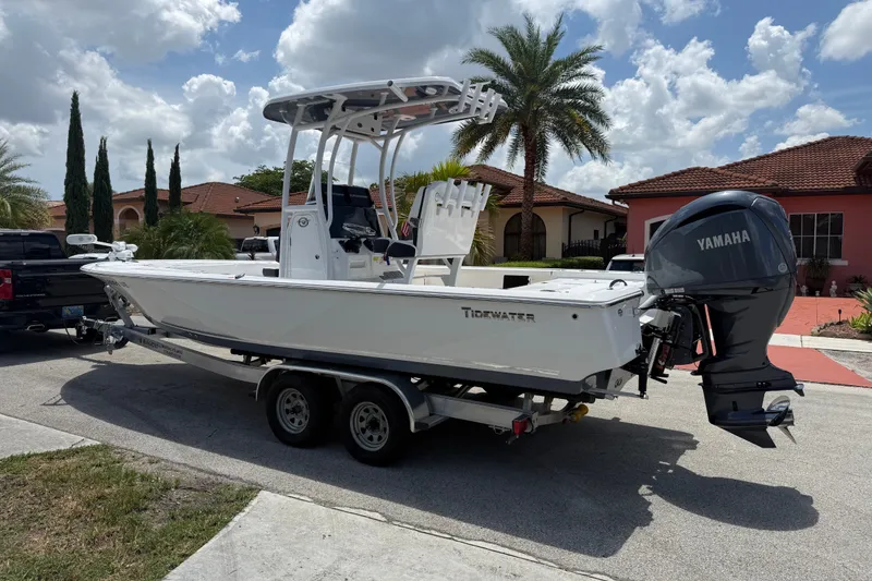 Slide: The Image of 2022 Tidewater 2410 Bay Max boat on trailer, parked in residential area. - 8