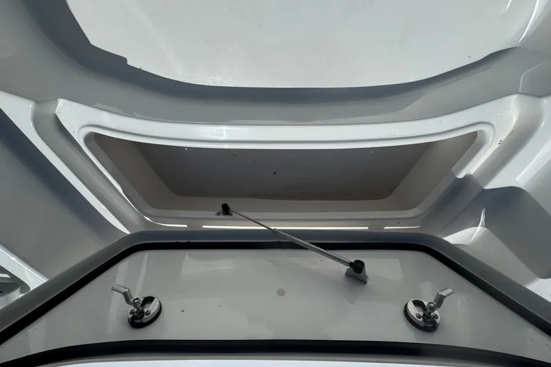 Slide: The Image of Storage compartment of 2022 Tidewater 2410 Bay Max boat, featuring sleek design and secure latches. - 40