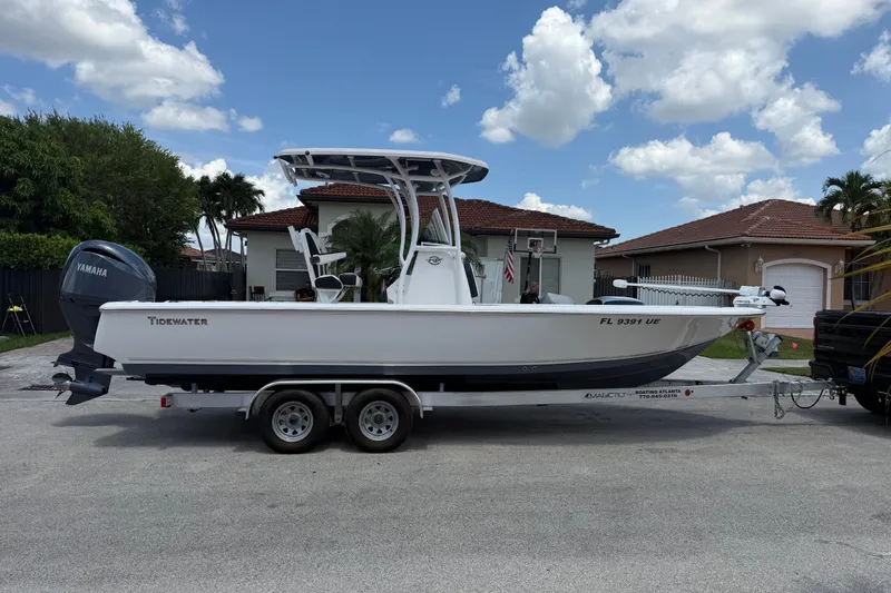 Slide: The Image of 2022 Tidewater 2410 Bay Max boat on trailer, parked in residential area. - 5