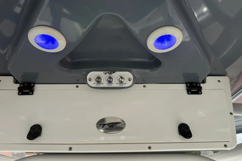 Slide: The Image of 2022 Tidewater 2410 Bay Max boat console with blue LED lights and control panel. - 29
