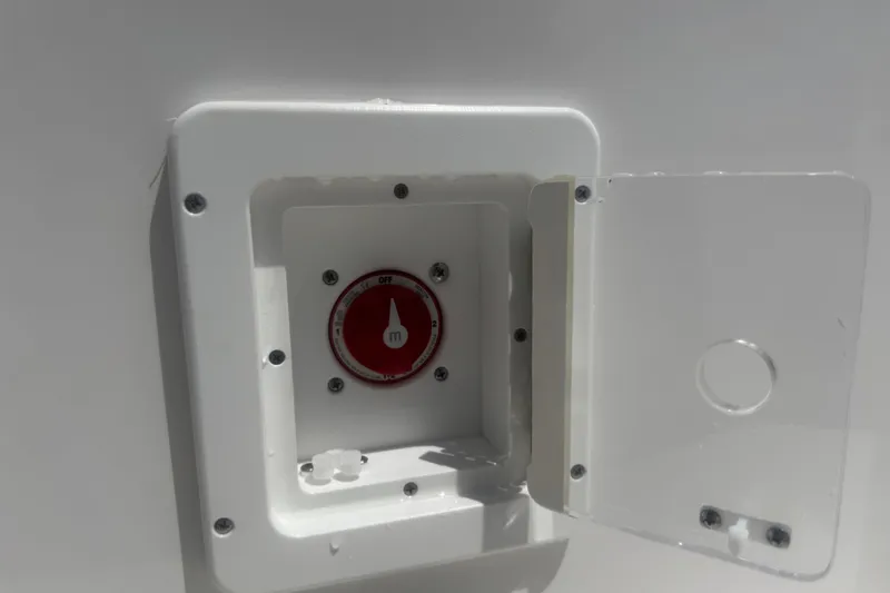 Slide: The Image of 2022 Tidewater 2410 Bay Max boat battery switch with open cover. - 31