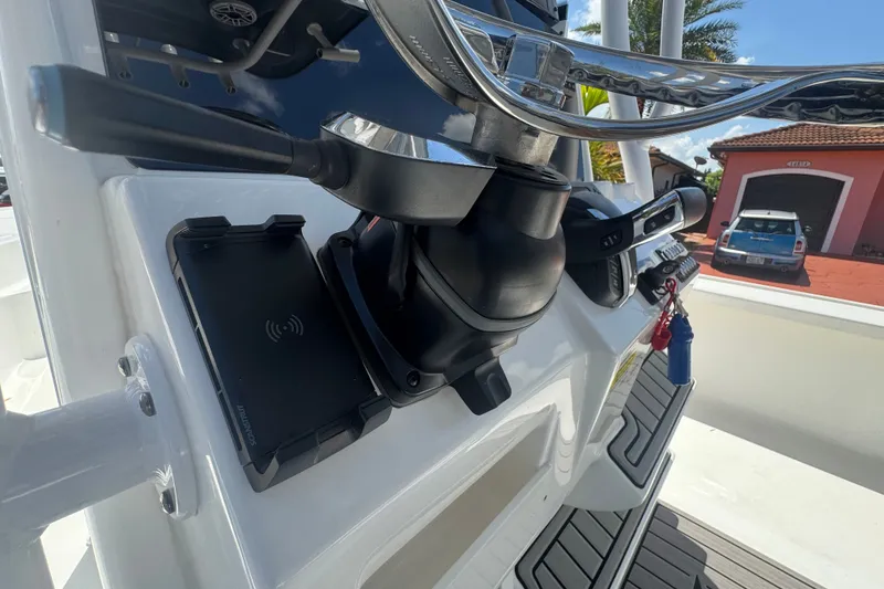 Slide: The Image of 2022 Tidewater 2410 Bay Max boat console with steering wheel and controls. - 21