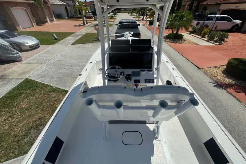 Slide: The Image of 2022 Tidewater 2410 Bay Max boat parked in a residential driveway. - 34