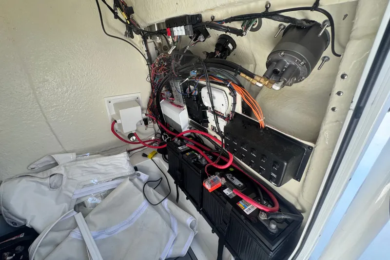Slide: The Image of 2022 Tidewater 2410 Bay Max boat electrical system with wiring and batteries. - 45