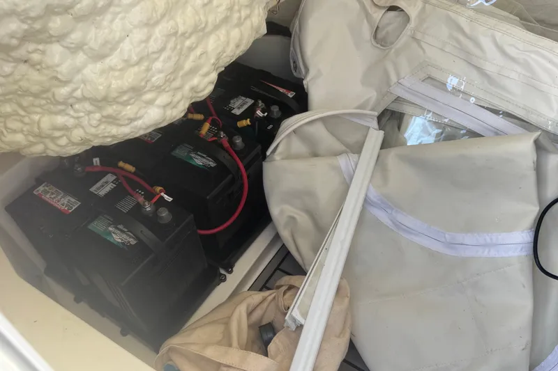 Slide: The Image of 2022 Tidewater 2410 Bay Max boat batteries and storage compartment. - 44