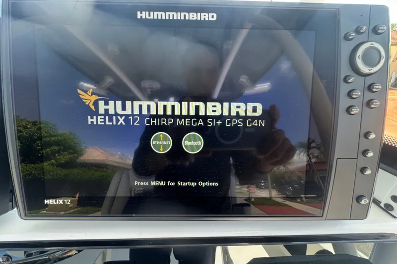 Slide: The Image of Humminbird Helix 12 fishfinder display on 2022 Tidewater 2410 Bay Max boat. - 24