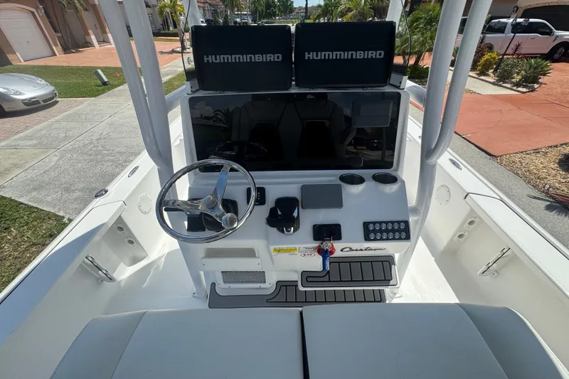 Slide: The Image of 2022 Tidewater 2410 Bay Max boat console with steering wheel and Humminbird electronics. - 20