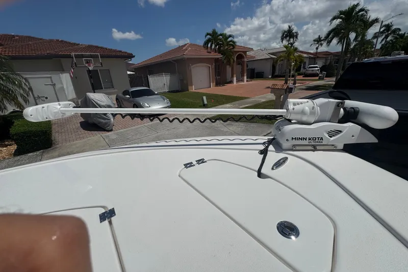 Slide: The Image of Minn Kota Ulterra trolling motor on 2022 Tidewater 2410 Bay Max boat in residential area. - 36