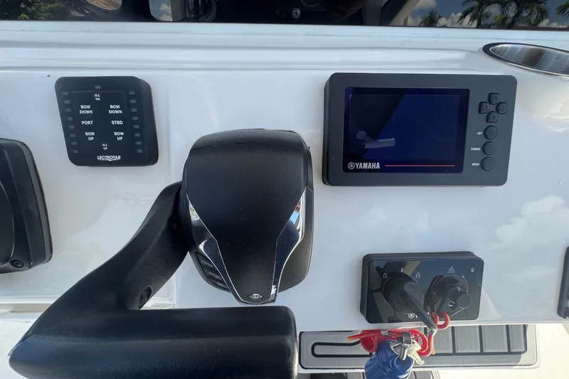 Slide: The Image of Control panel of 2022 Tidewater 2410 Bay Max boat with Yamaha display and throttle. - 25