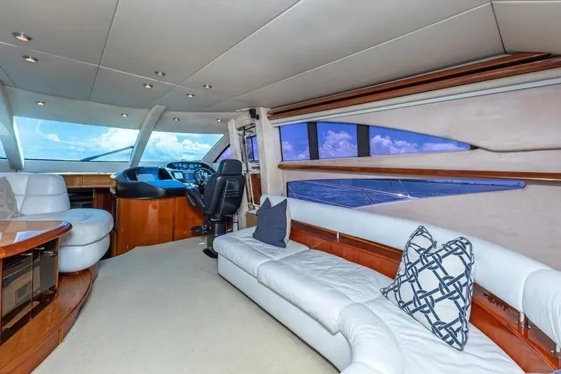 Slide: The Image of Luxurious interior of 2000 Sunseeker Manhattan 74 yacht with plush seating and panoramic windows. - 33